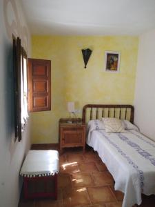 A bed or beds in a room at Masico Santana