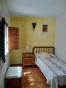 A bed or beds in a room at Masico Santana