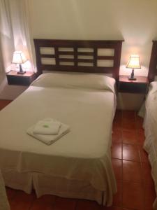 Uma cama ou camas num quarto em Hotel Colonial