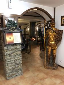 a statue of a man standing next to a sign at Apartment 507 The Castle 1 in Pamporovo