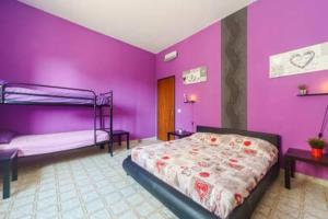 Posteľ alebo postele v izbe v ubytovaní Villa Vacanze Giuseppe
