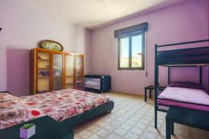 Posteľ alebo postele v izbe v ubytovaní Villa Vacanze Giuseppe
