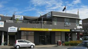
a car is parked in front of a building at Ariki Backpackers in New Plymouth
