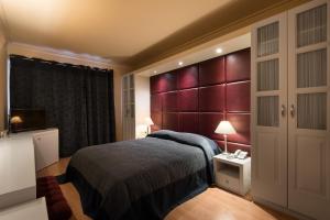 Tempat tidur dalam kamar di Lagadia Resort