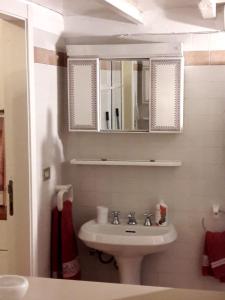 a bathroom with a sink and a mirror at La Casa delle Viti in Sestri Levante