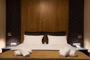 Postel nebo postele na pokoji v ubytování Kentrikon Hotel