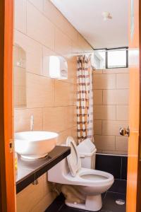 a bathroom with a sink and a toilet at ica wasi hostel in Ica