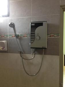 A bathroom at holiday home bagan lalang 5 aircon