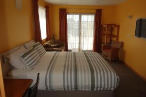 Postel nebo postele na pokoji v ubytování Beachside Villas Motel