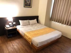 Кровать или кровати в номере Melody Hotel