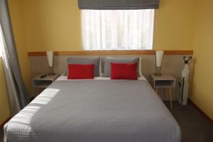Säng eller sängar i ett rum på Beachside Villas Motel