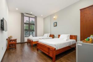 Una cama o camas en una habitación de Bamboo Hotel