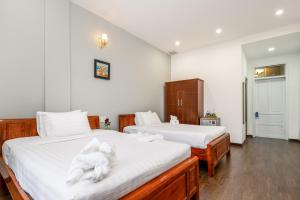 Una cama o camas en una habitación de Bamboo Hotel