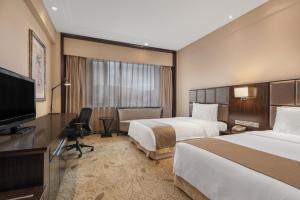 Postel nebo postele na pokoji v ubytování Holiday Inn Mudanjiang by IHG