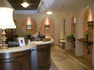 a salon with a reception counter in a room at Villa Ambrosina in Impruneta