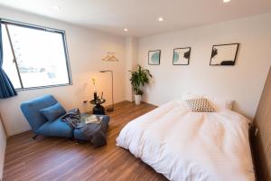 Un ou plusieurs lits dans un hébergement de l'établissement TORA HOTEL Tokyo Skytree 寅ホテル スカイツリーG