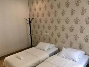 Postel nebo postele na pokoji v ubytování Island Hostel Bayan Lepas Airport