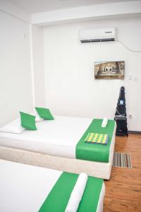 Postel nebo postele na pokoji v ubytování Lion Resort