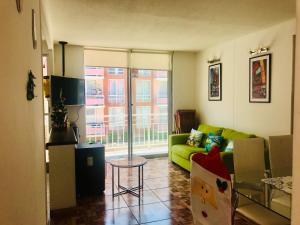 TV a/nebo společenská místnost v ubytování Cosmopolita Verde