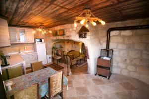 an aerial view of a kitchen and living room in a house at Kamelya Cave Hostel in Goreme