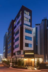 a rendering of a building at night at Bilek Hotel Kavacık in Istanbul