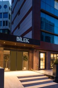 a building with a bulisk sign on the front of it at Bilek Hotel Kavacık in Istanbul