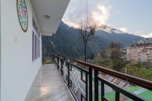 a balcony with a view of a mountain at Magellan's The Grand Lachen in Lachen