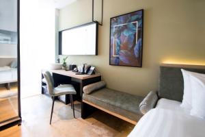 Postel nebo postele na pokoji v ubytování Hotel NuVe Elements