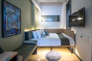 Postel nebo postele na pokoji v ubytování Hotel NuVe Elements