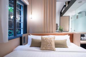 Tempat tidur dalam kamar di Hotel NuVe Elements