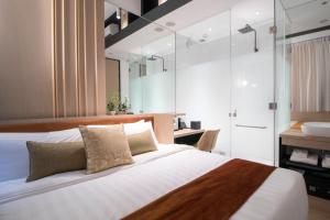 Postel nebo postele na pokoji v ubytování Hotel NuVe Elements