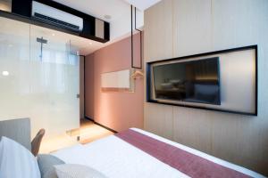 Postel nebo postele na pokoji v ubytování Hotel NuVe Elements