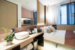 Postel nebo postele na pokoji v ubytování Hotel NuVe Elements