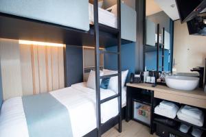 Postel nebo postele na pokoji v ubytování Hotel NuVe Elements