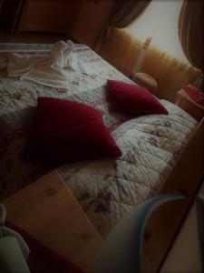 Voodi või voodid majutusasutuse Hotel Cima d'Oro toas