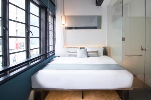 Postel nebo postele na pokoji v ubytování Hotel NuVe Elements