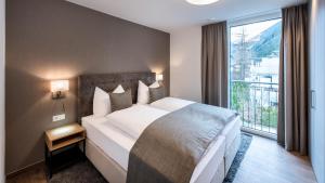 Postel nebo postele na pokoji v ubytování MANNI village - lifestyle apartments