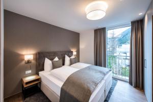 Postel nebo postele na pokoji v ubytování MANNI village - lifestyle apartments