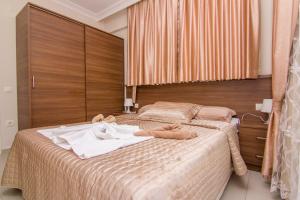 Postel nebo postele na pokoji v ubytování Körfez Garden Apartments