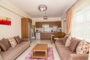 Kuchyň nebo kuchyňský kout v ubytování Körfez Garden Apartments