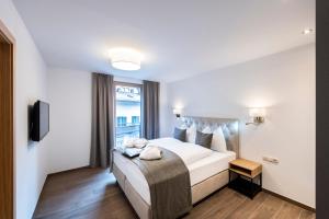 Posteľ alebo postele v izbe v ubytovaní MANNI home - rooms & apartments + 37 fotografií