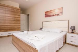 Postel nebo postele na pokoji v ubytování Körfez Garden Apartments