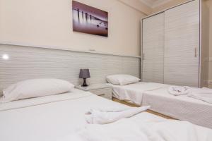 Postel nebo postele na pokoji v ubytování Körfez Garden Apartments