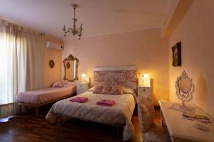 Postel nebo postele na pokoji v ubytování Felicidad Siempre B&B