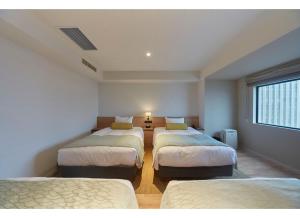 Postel nebo postele na pokoji v ubytování Sunshine City Prince Hotel Ikebukuro Tokyo