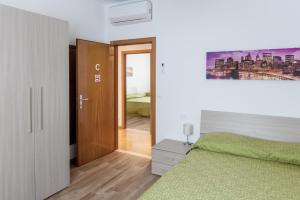 Tempat tidur dalam kamar di Appartamento Le Barche
