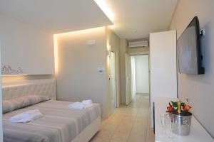Postel nebo postele na pokoji v ubytování Residence Hotel Alba Palace