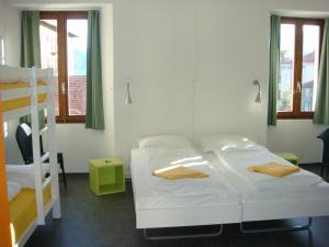 a room with a bed and a bunk bed and a ladder at Casa Da Vinci B&B in Locarno
