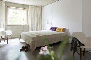 Un pat sau paturi într-o cameră la ipartment Cologne Muelheim