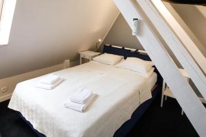 Postel nebo postele na pokoji v ubytování Apartamenty Vilda